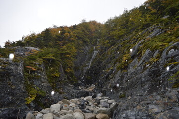 Hiking in the windy and snowy mountains of the Torres del Paine National Park in Patagonia, Chile