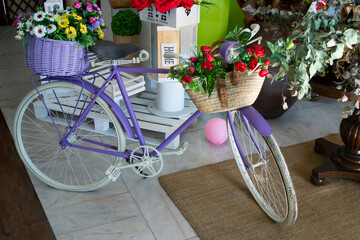 Fototapeta na wymiar Bicycle decorated with two baskets of flowers