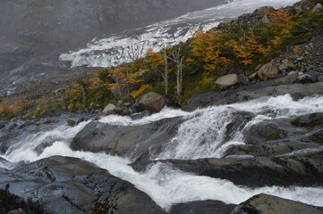 Hiking in the windy and snowy mountains of the Torres del Paine National Park in Patagonia, Chile