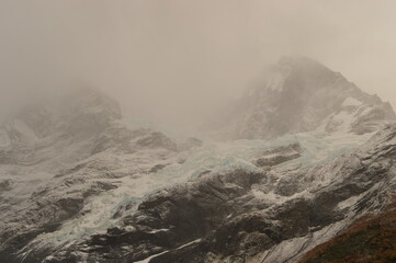 Obraz premium Hiking in the windy and snowy mountains of the Torres del Paine National Park in Patagonia, Chile