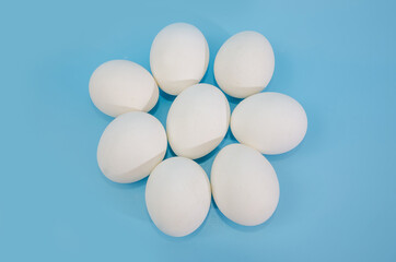 white eggs on a blue background.