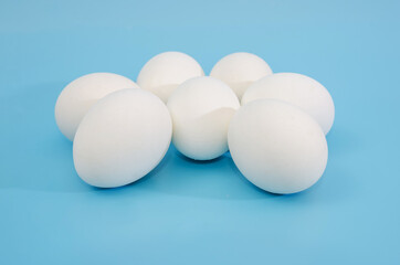 white eggs on a blue background.