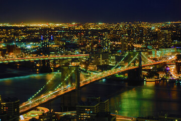 Fototapeta na wymiar Brooklyn Bridge with lower Manhattan skyline in New York City at night, USA