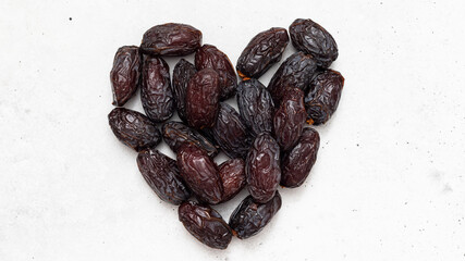 Juicy organic Medjool dates  on  background
