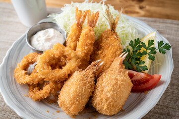 japanese deep fied seafood with cabbage and tartar sauce