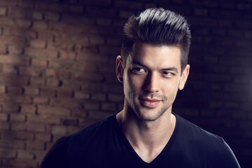 Portrait of handsome young caucasian man, looking at camera. 