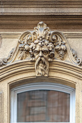 Elements of architectural decorations of buildings, gypsum stucco, plaster ornament. On the street of Budapest, public places.