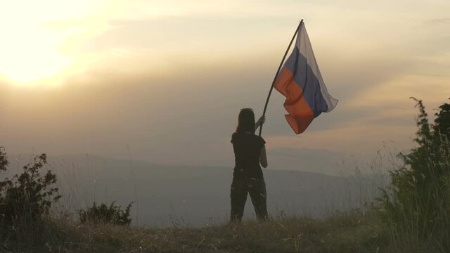 Russian patriots holding russian flag