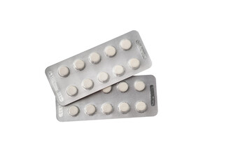 Medical pills or tablets in plastic package isolated on white background.