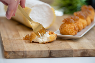 Tapas plate of Spanish ham and cheese croquettes with onions