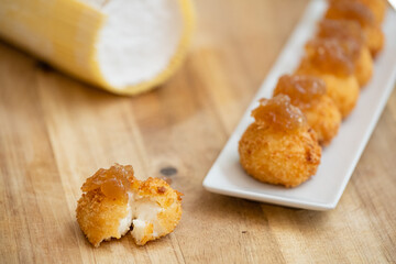 Tapas plate of Spanish ham and cheese croquettes with onions