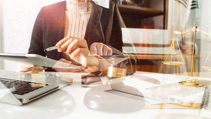 Business and lawyers discussing contract papers with brass scale on desk in office. Law, legal services, advice, justice and law concept picture with film grain effect