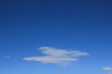 White clouds in blue sky background.
