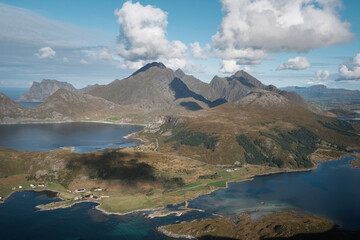 Naklejka na ściany i meble View from famous mountain on Lofoten Islands. Veiew over the fall colored islands. Pure nature appropriate for better immunity. Perfect getaway from covid-19 situation. Steep mountains at the back.