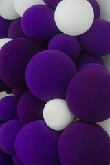Closeup of purple and white balloons