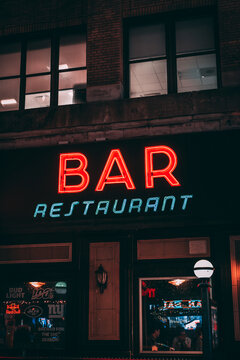 Bar & Restaurant Neon Sign At Night In Hells Kitchen, Manhattan, New York City