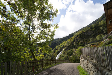 Fototapeta premium Footpath leading to the waterfall near city of Partschins, South Tirol, Italy.