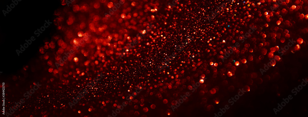 Wall mural background of abstract red, gold and black glitter lights. defocused