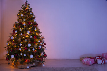 Christmas tree pine with gifts lights garland night New Year's