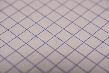Close-up of notebooks in a cage