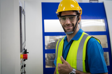 Engineer inspecting and checking operating process on machine monitor.