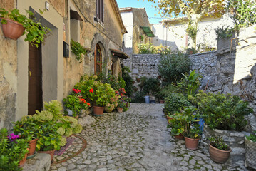 A narrow street between the old houses of Fumone, a medieval village in the province of Frosinone, Italy.