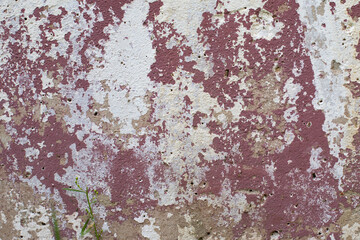 The texture of old concrete with old peeling paint in white and red. Background for design