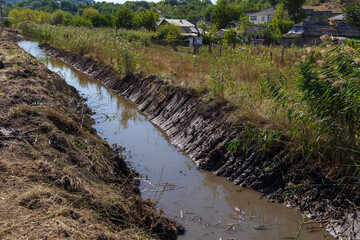 Drainage channel for rainwater on the outskirts of the city