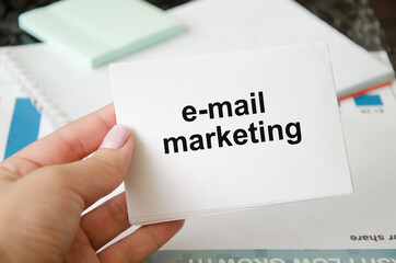  the email marketing text is written on a notepad. business messages, correspondence with colleagues, messaging
