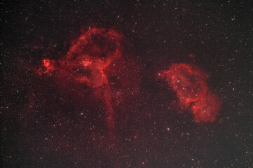 The Heart (IC 1805) and Soul (IC 1848) nebulae , two hydrogen alpha rich nebulae  glowing in the night sky