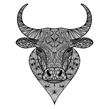 Patterned head of bull or ox. Taurus, buffalo painted tribal ethnic ornament. Hand drawn coloring book in ornate doodle style. Animal face design. Print for t-shirts.