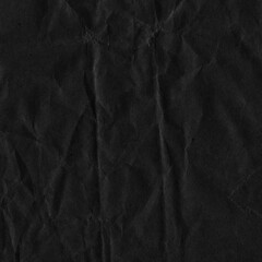 Fototapeta premium Black vintage and old looking crumpled paper background. Retro cardboard texture. Grunge paper for drawing. Ancient book page. Present wrapping.