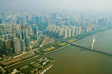 Fototapeta na wymiar Guangzhou town and Pearl river view from windows of Canton tower