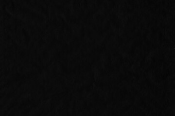 Black vintage and old looking crumpled paper background. Retro cardboard texture. Grunge paper for drawing. Ancient book page. Present wrapping.