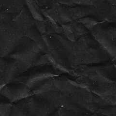 Black vintage and old looking crumpled paper background. Retro cardboard texture. Grunge paper for drawing. Ancient book page. Present wrapping.