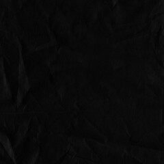Black vintage and old looking crumpled paper background. Retro cardboard texture. Grunge paper for drawing. Ancient book page. Present wrapping.