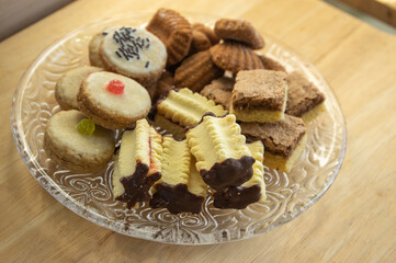 Group of delicious sweet Christmas cookies, white vanilla rolls, gingerbread, linzer and chocolate sweets wiht jam filling