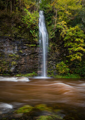 After prolonged heavy rainfall a waterfall appeared on the river Tawe in the Swansea Valley, South Wales UK
