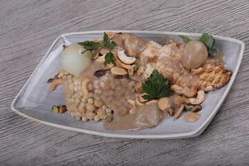 Fish fillet With the grains Dough sauce And chickpeas Decorated With green parsley And cooked onions