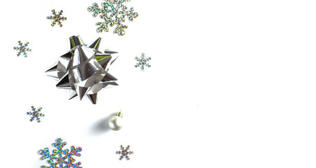 Flatley Christmas. Christmas or New Year composition with silver decorations on a white background. copyspace