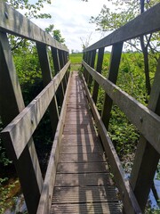 Fototapeta na wymiar wooden foot bridge straight centre view