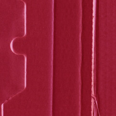 Fototapeta premium A red vintage rough sheet of carton. Recycled environmentally friendly cardboard paper texture. Simple and bright minimalist papercraft background.
