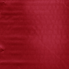 A red vintage rough sheet of carton. Recycled environmentally friendly cardboard paper texture. Simple and bright minimalist papercraft background.