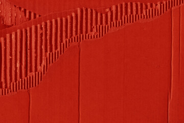 A red vintage rough sheet of carton. Recycled environmentally friendly cardboard paper texture. Simple and bright minimalist papercraft background.
