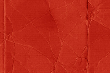 Obraz premium A red vintage rough sheet of carton. Recycled environmentally friendly cardboard paper texture. Simple and bright minimalist papercraft background. 