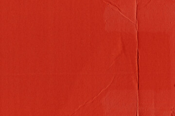 Fototapeta premium A red vintage rough sheet of carton. Recycled environmentally friendly cardboard paper texture. Simple and bright minimalist papercraft background. 