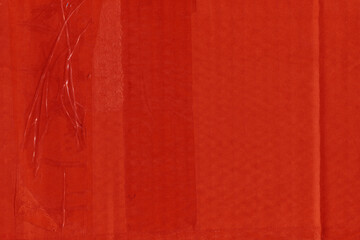 Fototapeta premium A red vintage rough sheet of carton. Recycled environmentally friendly cardboard paper texture. Simple and bright minimalist papercraft background. 