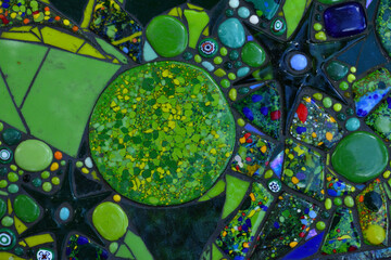 Shiny colourful green blue turquoise stones decorated in pattern making textures for background