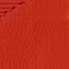 Fototapeta premium A red vintage rough sheet of carton. Recycled environmentally friendly cardboard paper texture. Simple and bright minimalist papercraft background. 
