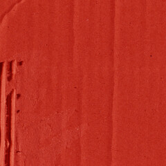 A red vintage rough sheet of carton. Recycled environmentally friendly cardboard paper texture. Simple and bright minimalist papercraft background.
